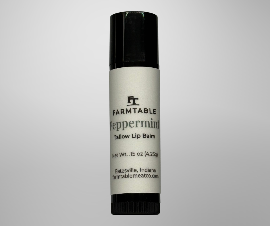 Lip balm tube with 'Farmtable' branding on a gray background