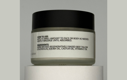 Skincare jar with black lid and white label on a gray background