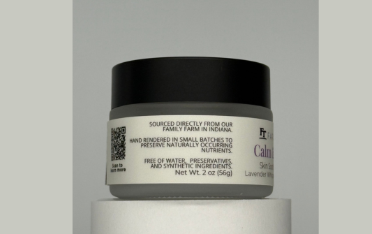Jar of Calming Skin Cream on a gray background