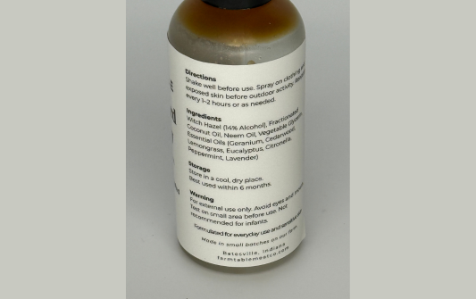 Bottle with label on a gray background