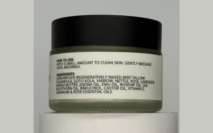 Cosmetic jar with black lid and white label on a gray background