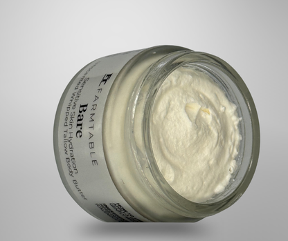 Jar of Farmtable Bare whipped lotion on a gray background