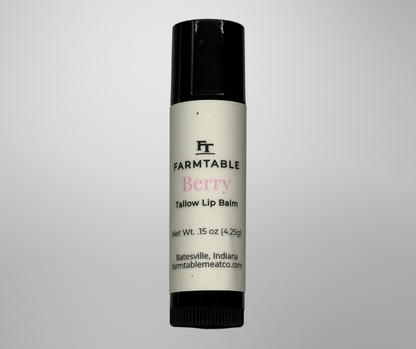 Lip balm with 'Farmtable' branding on a gray background