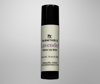 Lip balm container with 'Farmtable' branding on a gray background