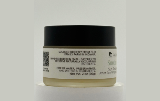 Jar of skincare product with a black lid and white label on a light gray background