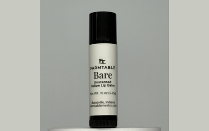 Farmtable Bare lip balm on a gray background