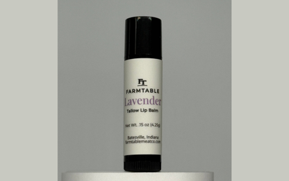 Lip balm tube labeled 'Farmtable Lavender' on a gray background