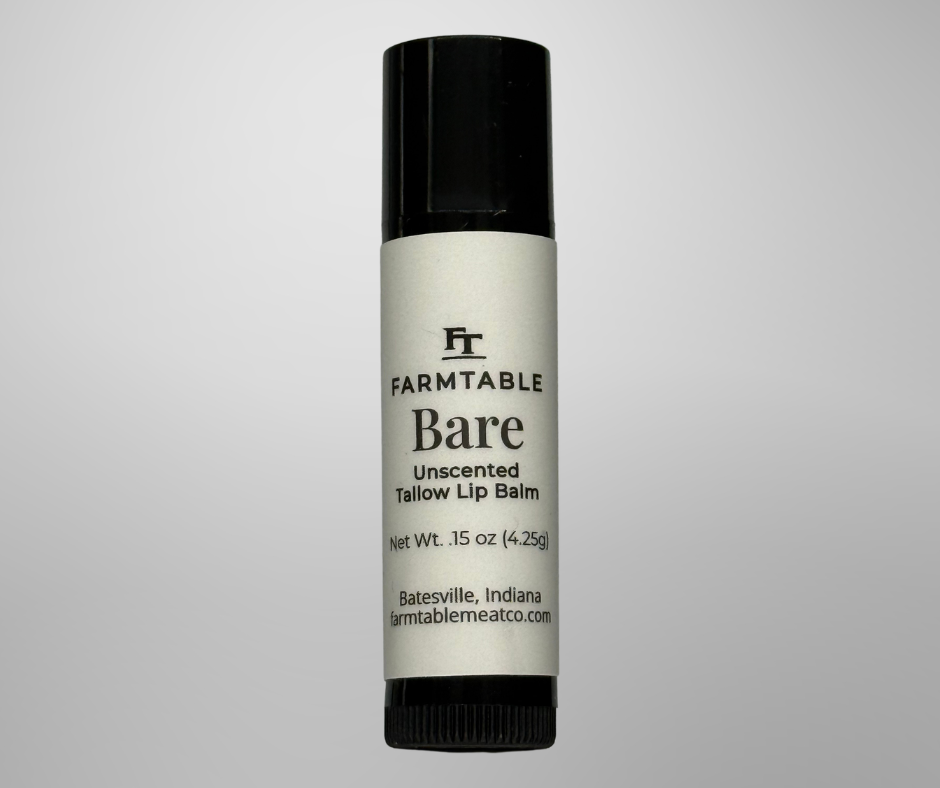 Farmtable Bare unscented tallow lip balm on a gray background