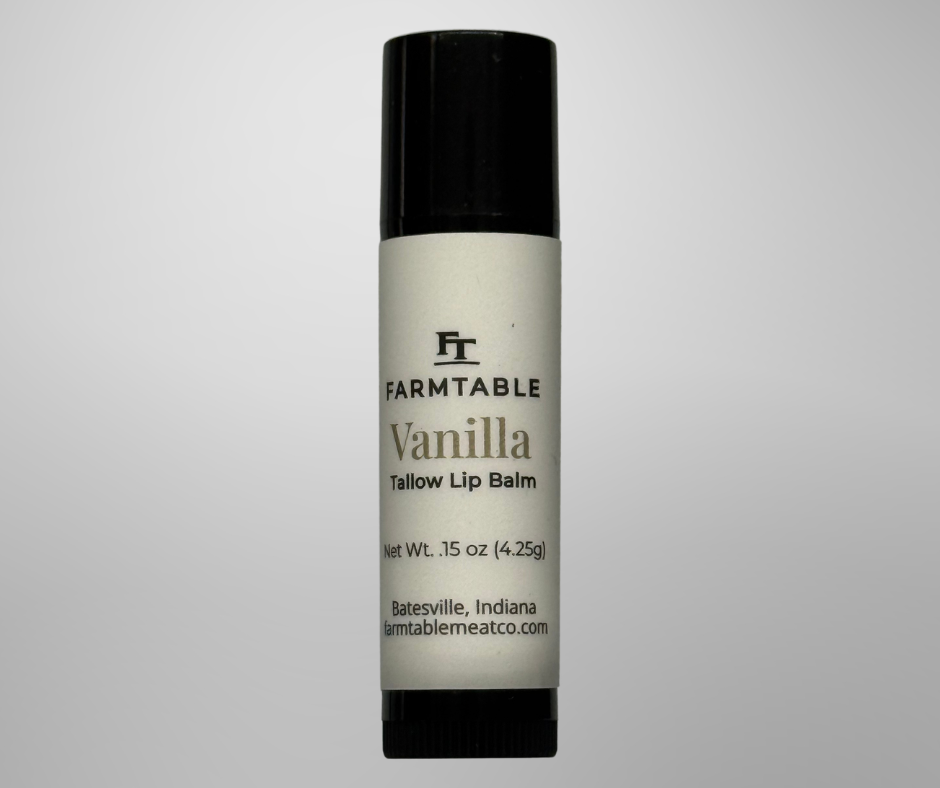 Vanilla lip balm with black cap and white container on a gray background