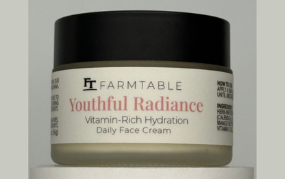 Jar of Farmtable Youthful Radiance Vitamin-Rich Hydration Daily Face Cream on a gray background