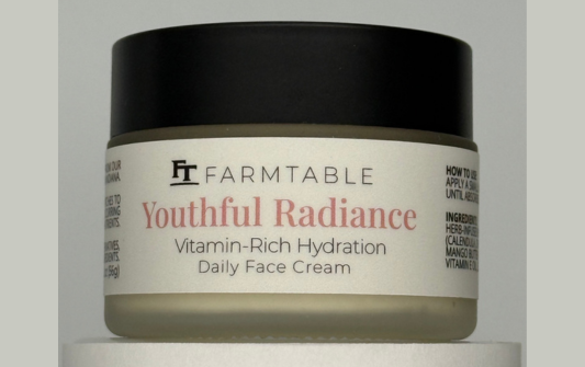 Jar of Farmtable Youthful Radiance Vitamin-Rich Hydration Daily Face Cream on a gray background