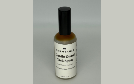 Farmtable Gentle Guard Tick Spray bottle on a gray background